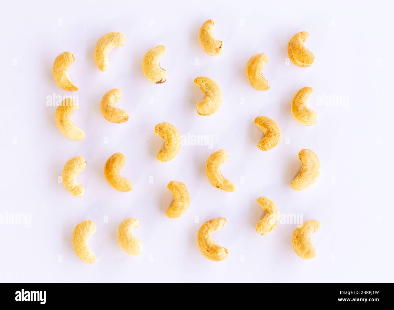 Roasted Cashew nuts isolated on white background with clipping path and full depth of field. Set or collection. Stock Photo
