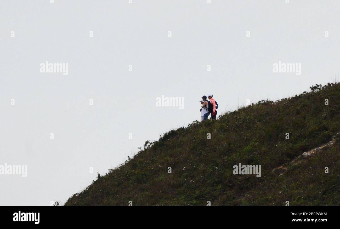 Hikers climbing Yuk Kwai Shan. Stock Photo