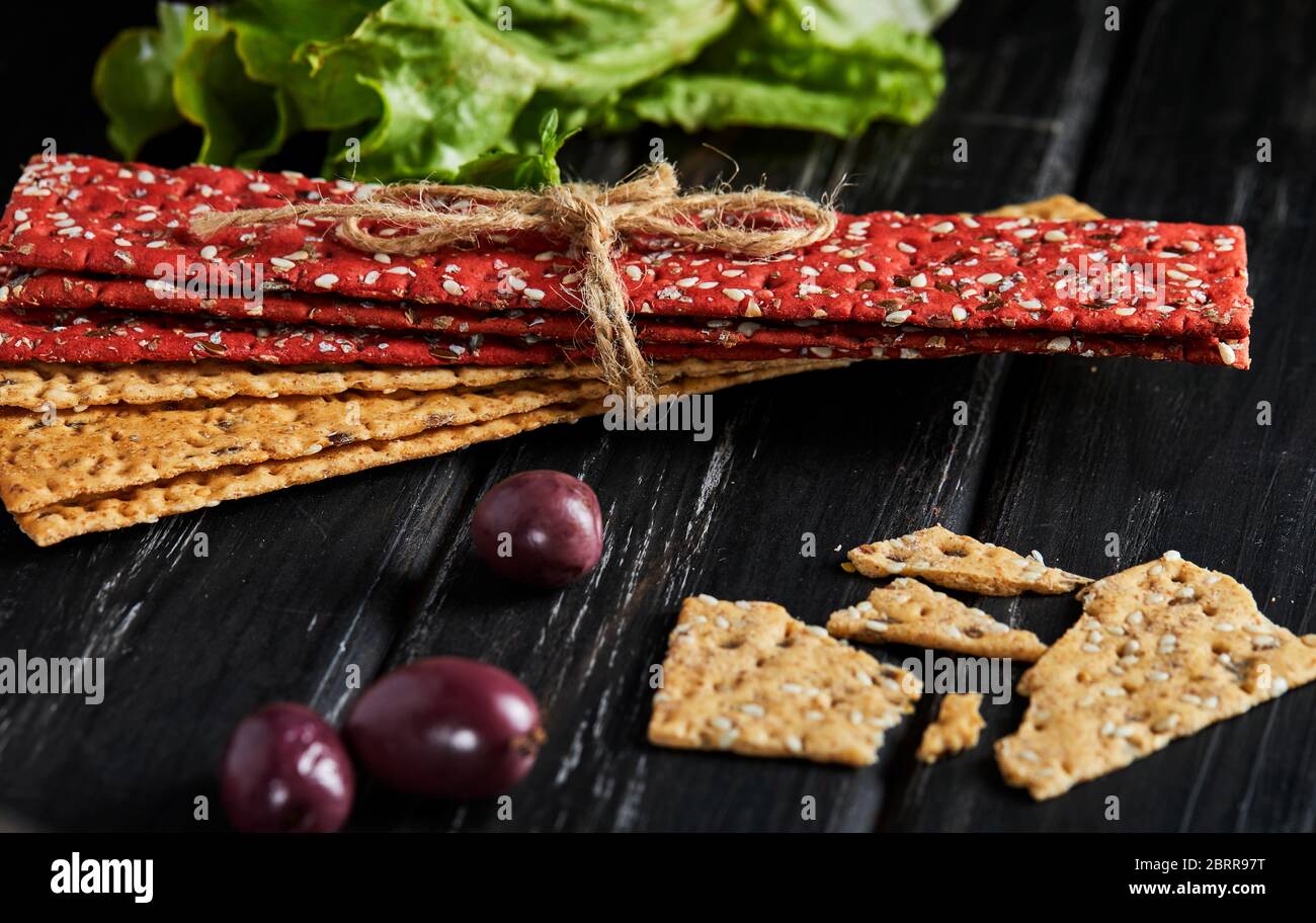 Beetroot and rye flour crackers with vegetables for making snacks on a ...