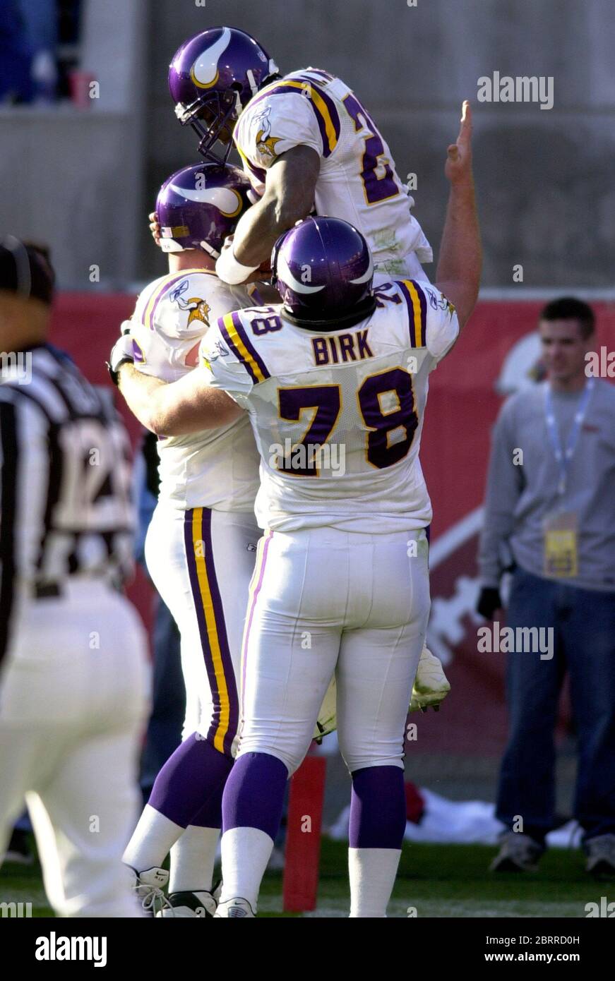 Tempe, United States. 28th Dec, 2003. Minnesota Vikings running back Moe  Williams is hoisted by Chris Liwienski (left) and Matt Birk (78) after a  1-yard touchdown run in the third quarter of