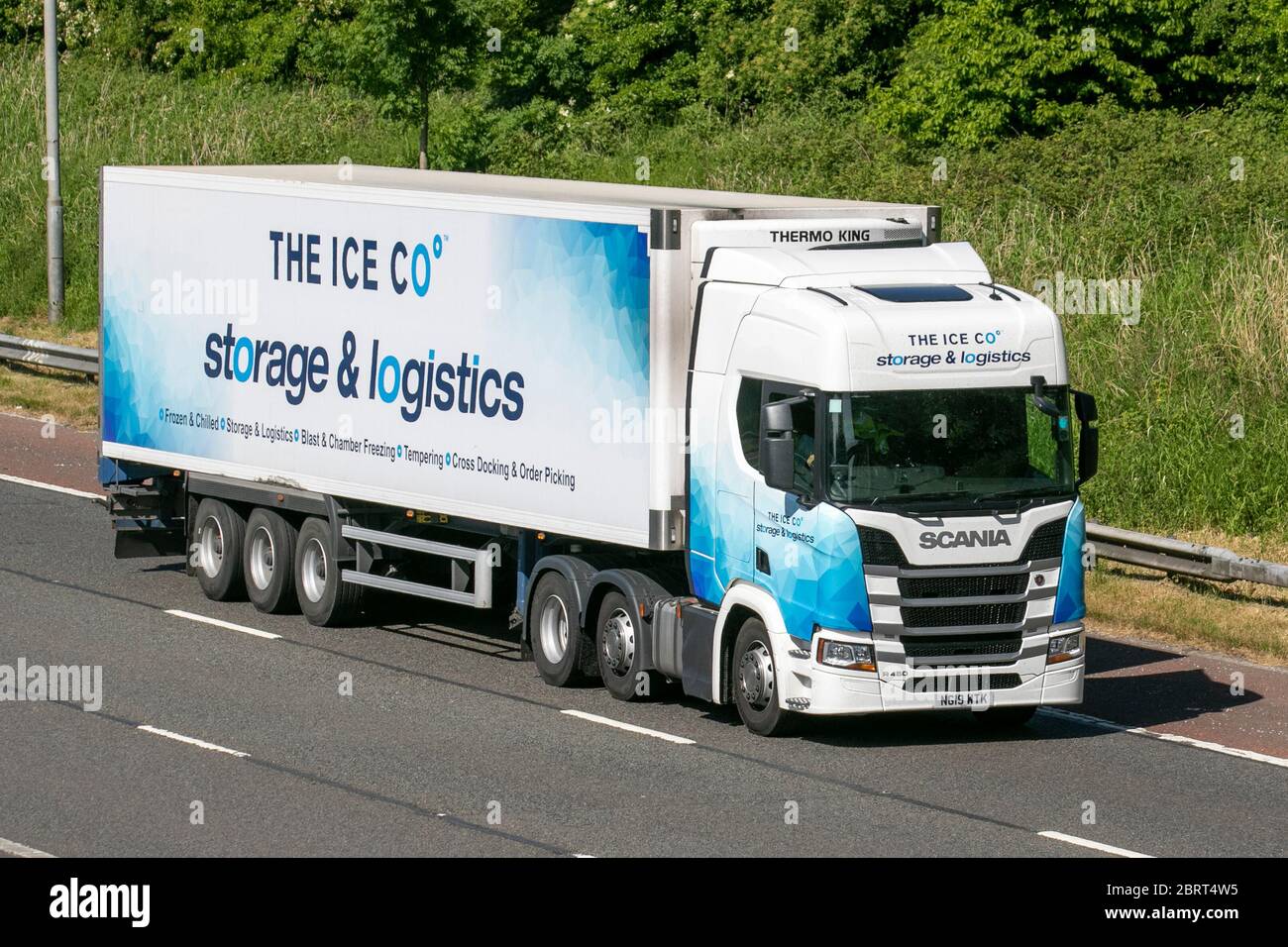 The Ice Co. Haulage delivery trucks, lorry, transportation, truck, cargo carrier, Scania vehicle, European commercial transport, industry, M6 at Manchester, UK Stock Photo