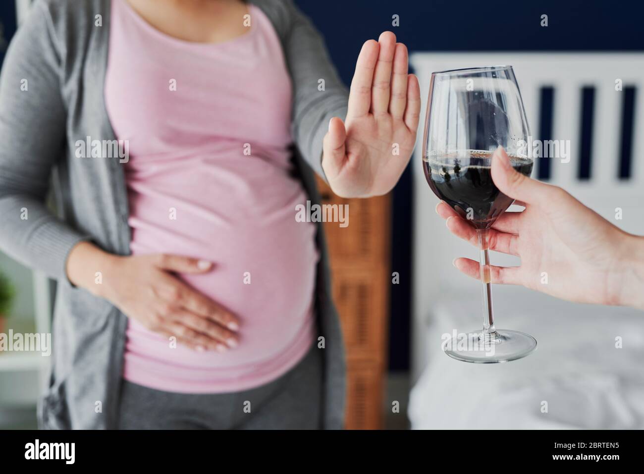 Pregnant woman refusing a glass of wine Stock Photo Alamy