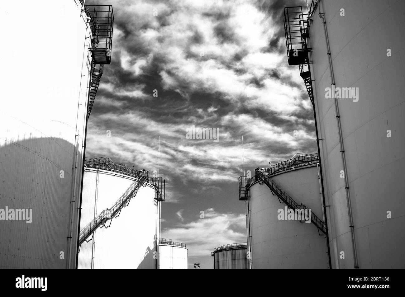 Crude oil tank in the oil refinery. Storage tanks for oil. Tanks for the storage of petroleum Crude oil tank in the oil refinery. Storage tanks for oil. Tanks for the storage of petroleum