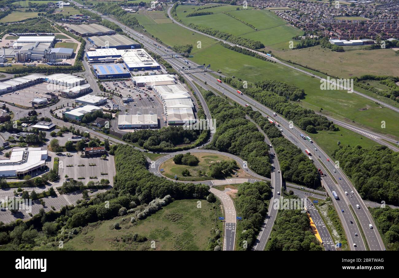 aerial view of Birstall Shopping Park at junction 27 of the M62 at Batley, West Yorkshire Stock Photo