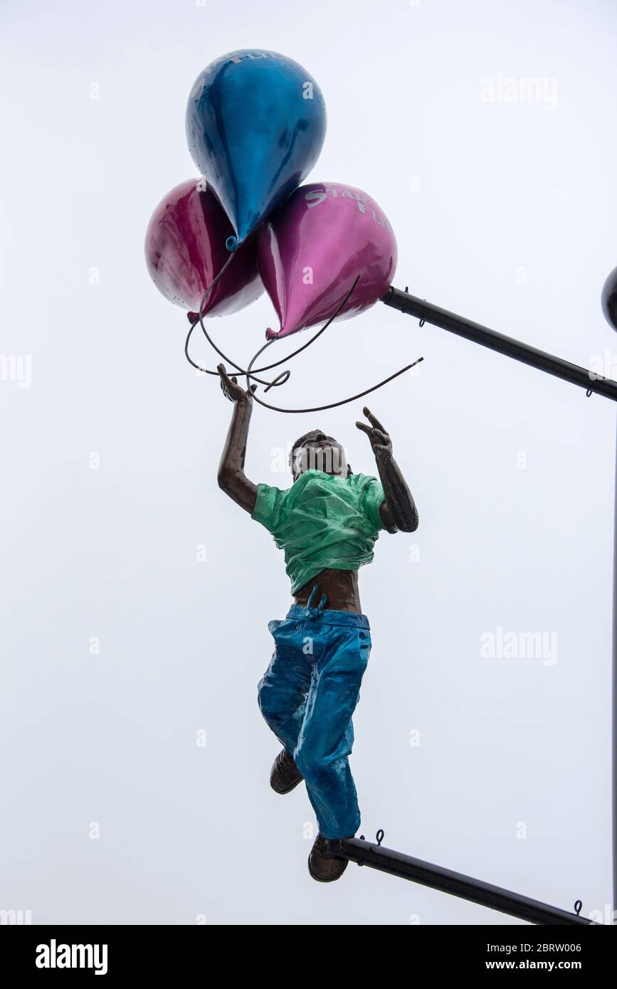Boy with balloons at funfair attraction on International Drive, Orlando, Florida. Stock Photo