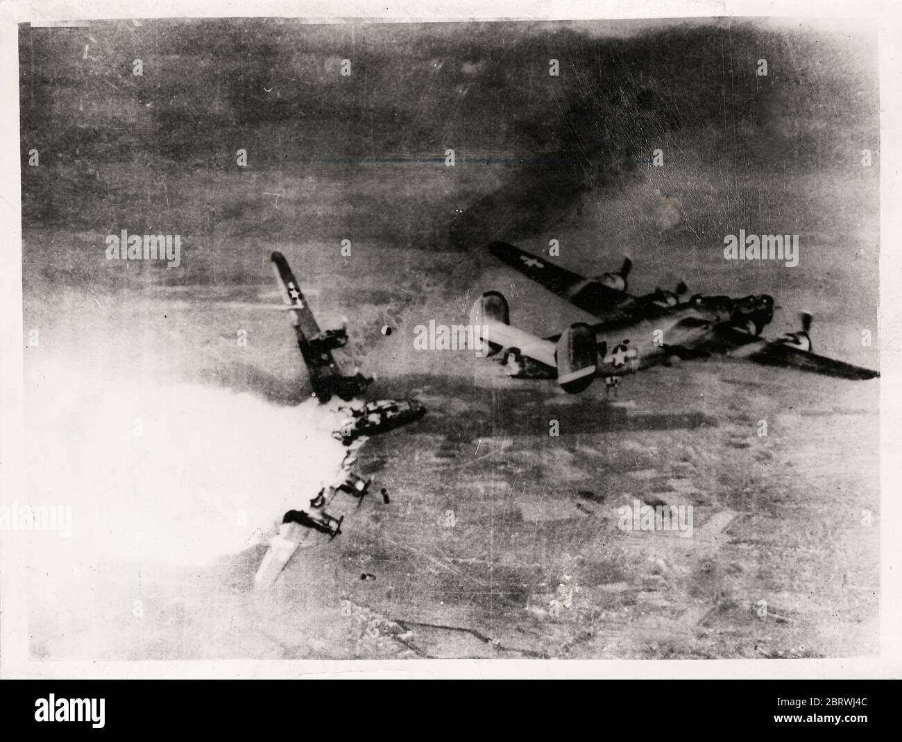 Vintage World War II photograph - B-24H Liberator bomber of 783rd Bomb Squadron, 465th Bomb Group, US 15th Air Force exploding in mid air after being hit by anti-aircraft fire over Germany, 1944 Stock Photo