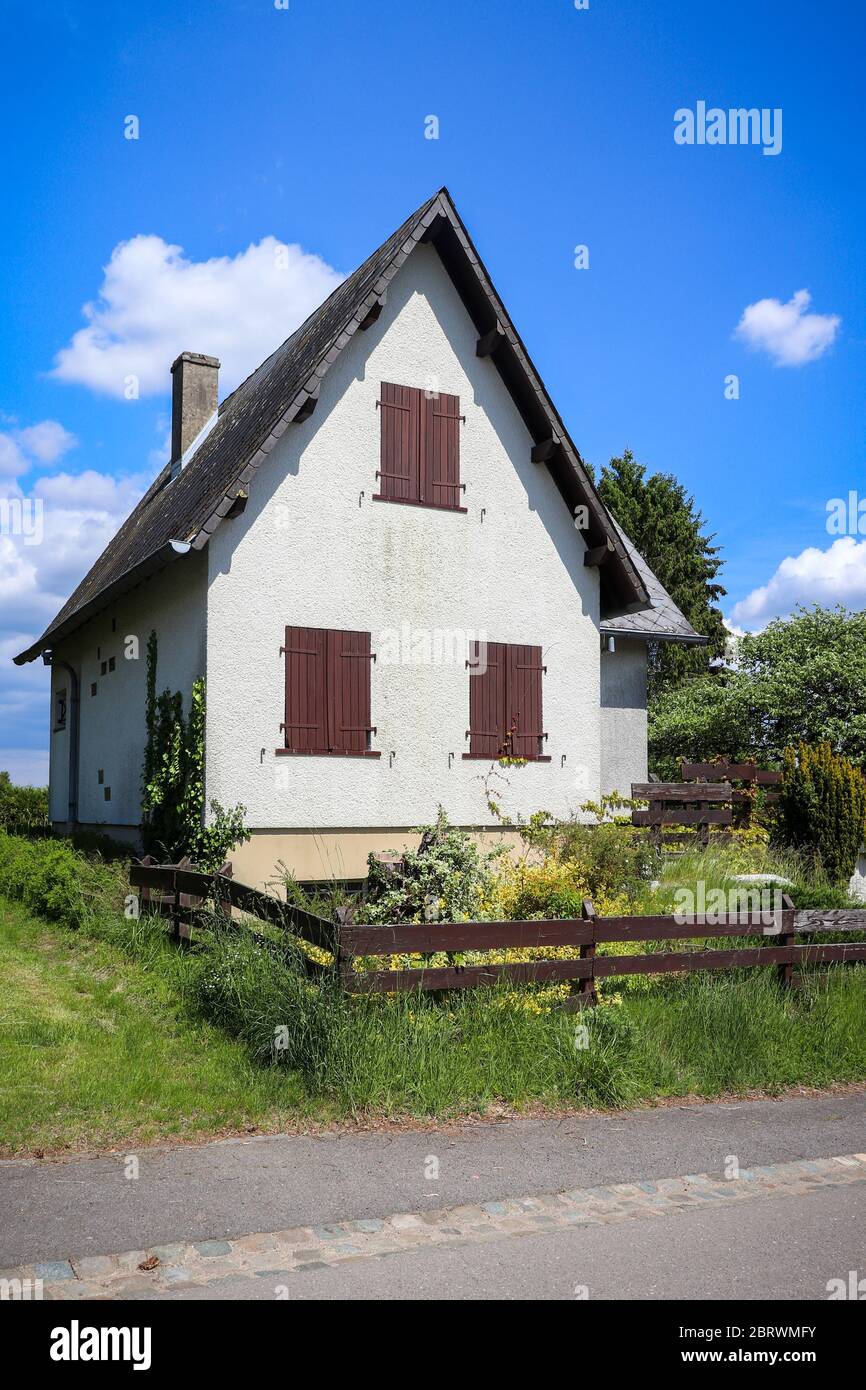 Cute little cottage in Berdorf, Luxembourg on a sunny spring afternoon. Stock Photo