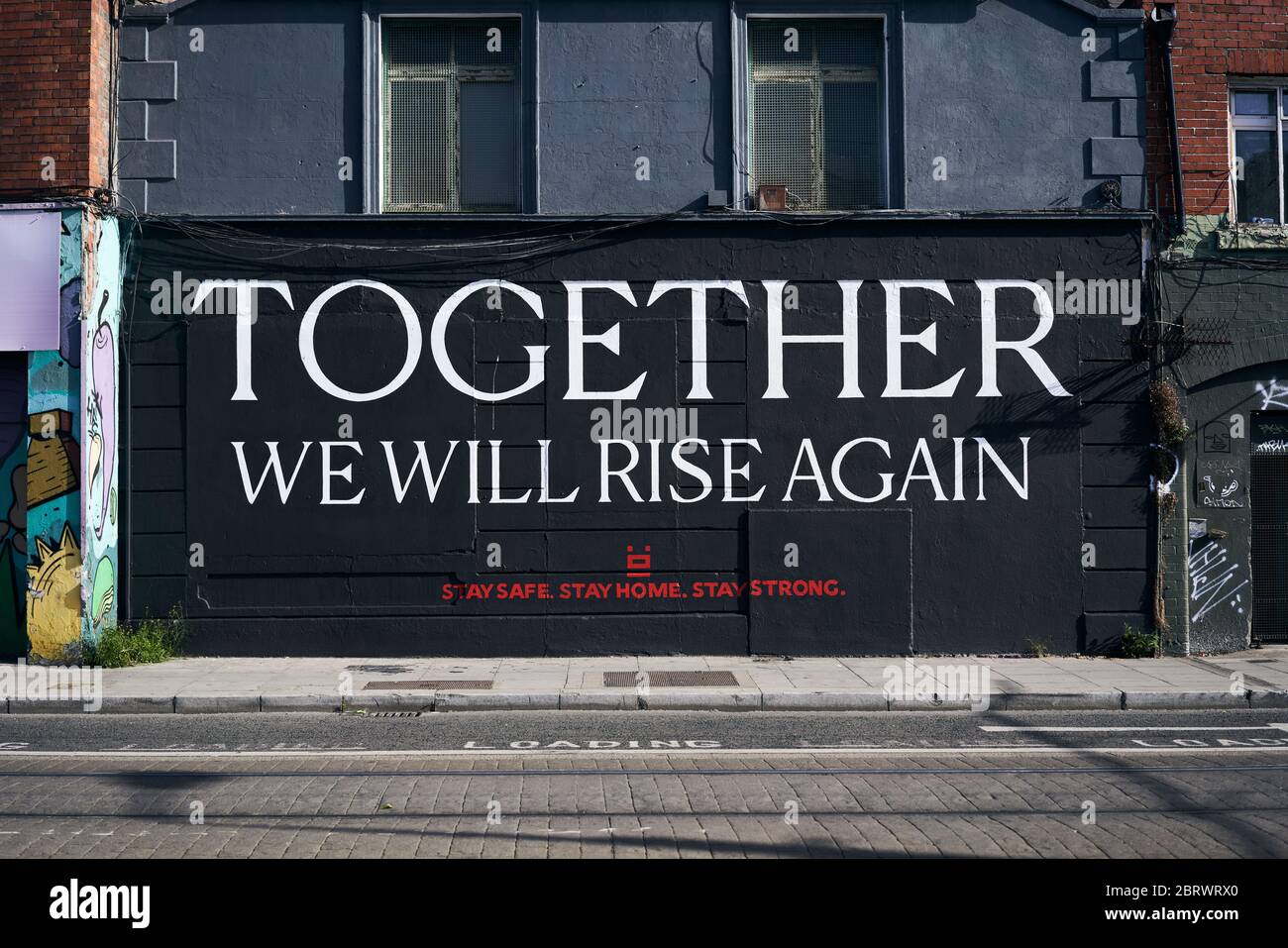 Mural in Dublin, Ireland, reading "Together we will rise again." Painted by local artists during the coronavirus pandemic. Stock Photo