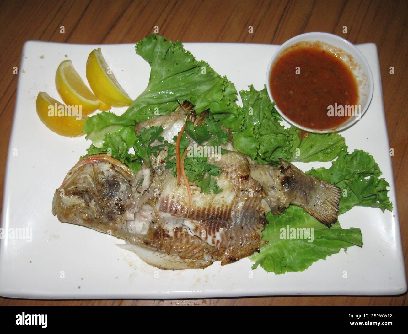 Grilled tilapia fish on the plate Stock Photo