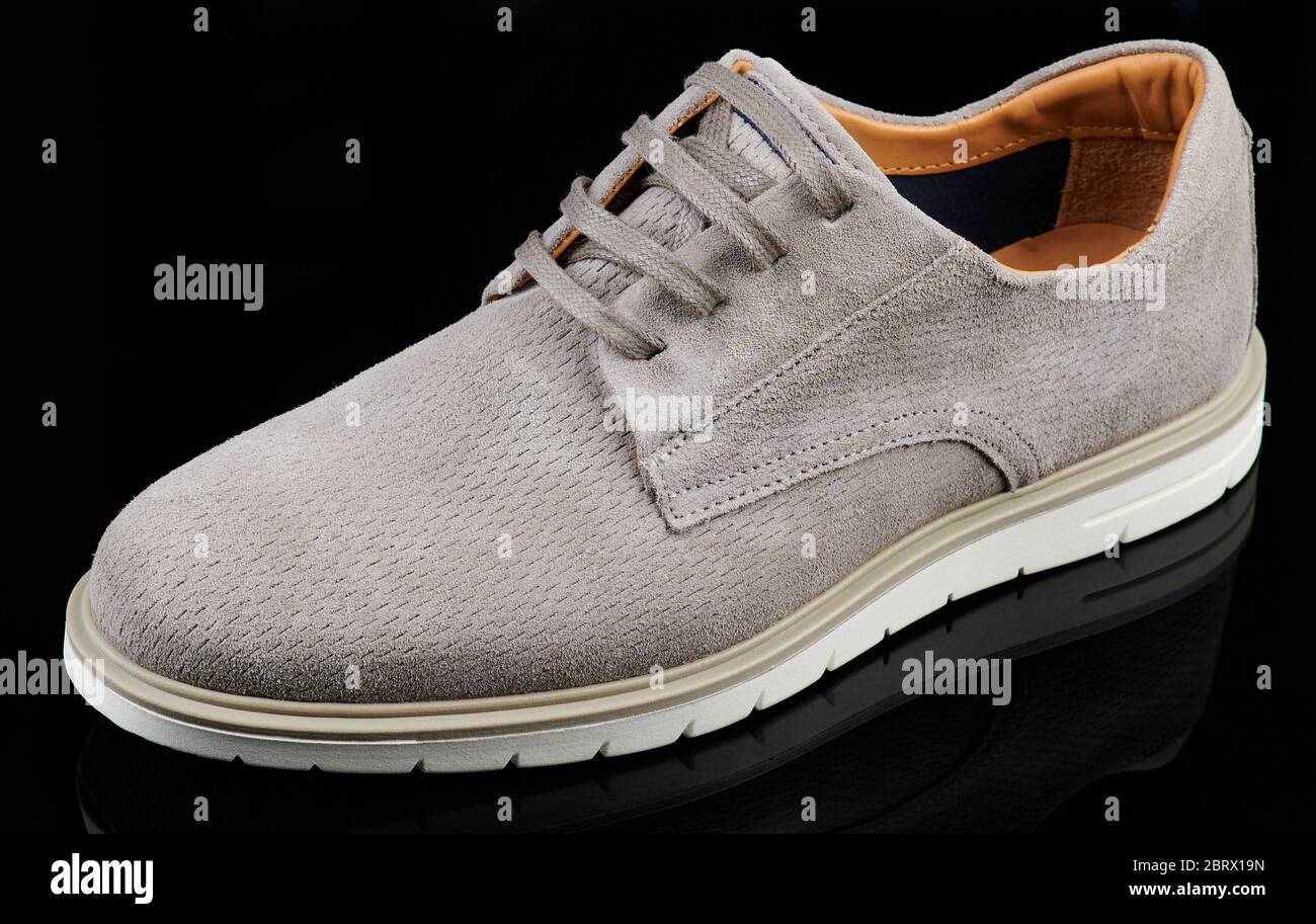 Elegance grey man shoe side view isolated on black background Stock Photo