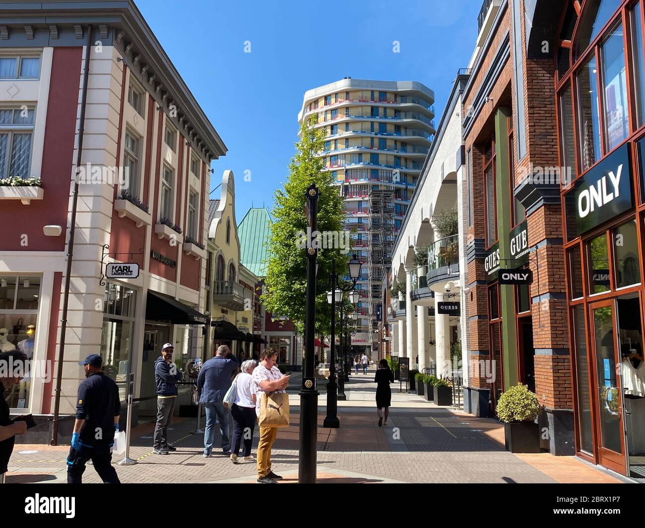 Roermond (designer outlet), Netherlands - May 19. 2020: View on exterior  shopping street in summer with blue sky Stock Photo - Alamy