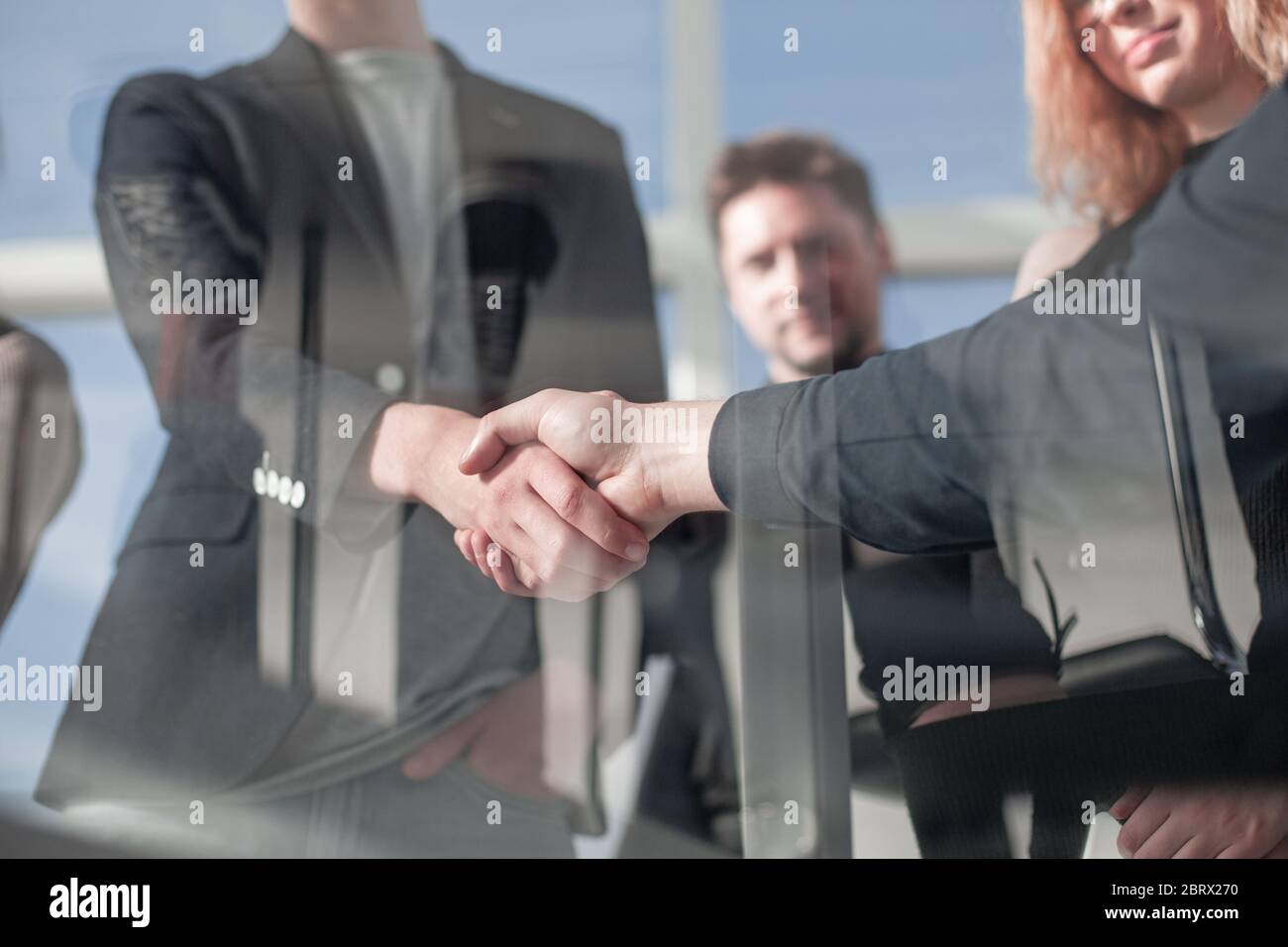 Architect and engineer construction workers shaking hands Stock Photo