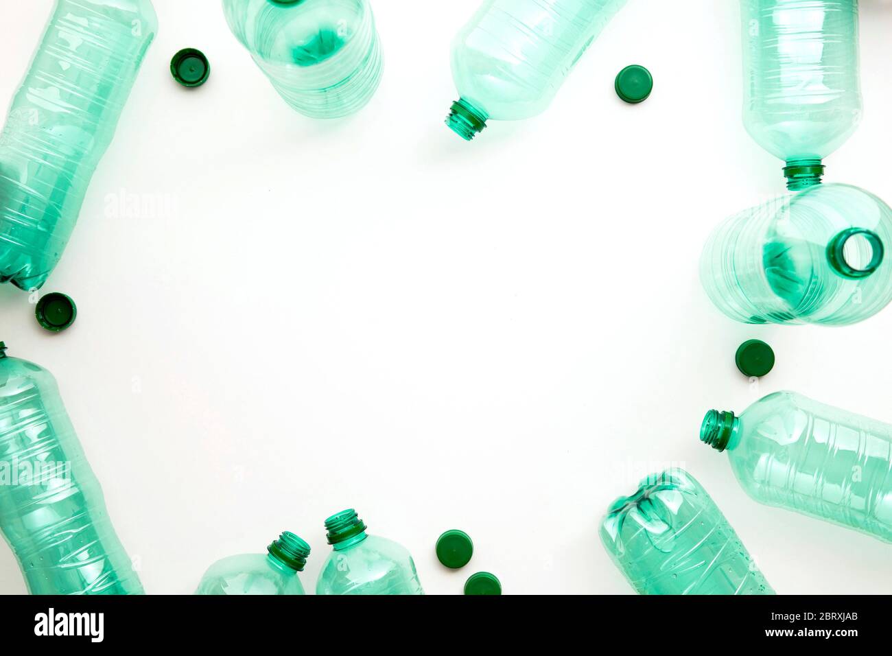 Empty green plastic waste water bottles ready to be recycled. Stock Photo