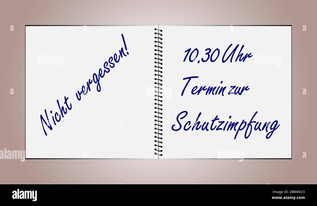 An opened notebook contains the German text Don't forget 10.30 a.m. Vaccination appointment Stock Photo