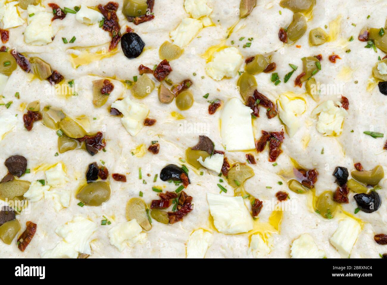 Leavened homemade Italian focaccia dough, a flat ovenbaked Italian