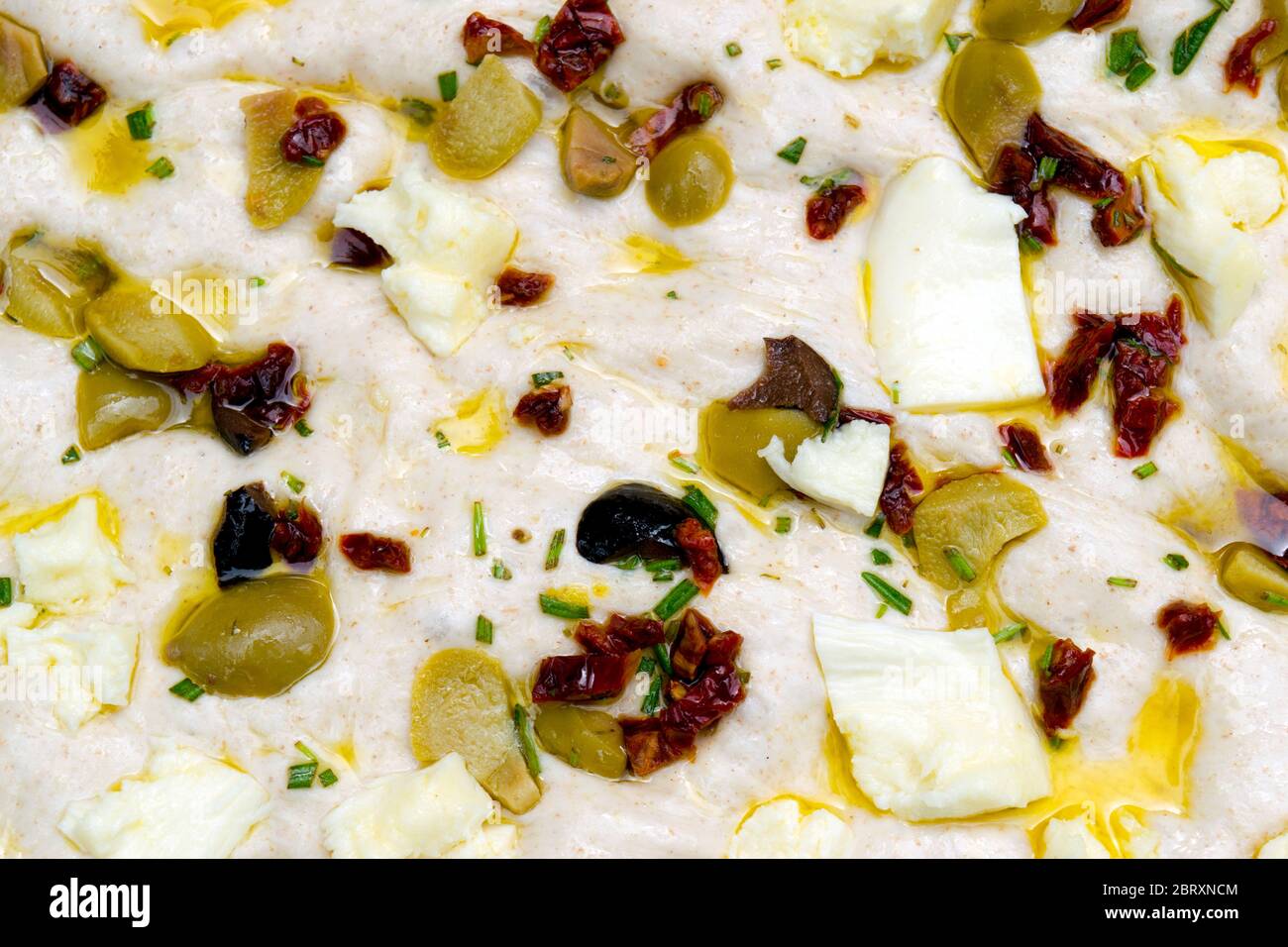 Leavened homemade Italian focaccia dough, a flat ovenbaked Italian