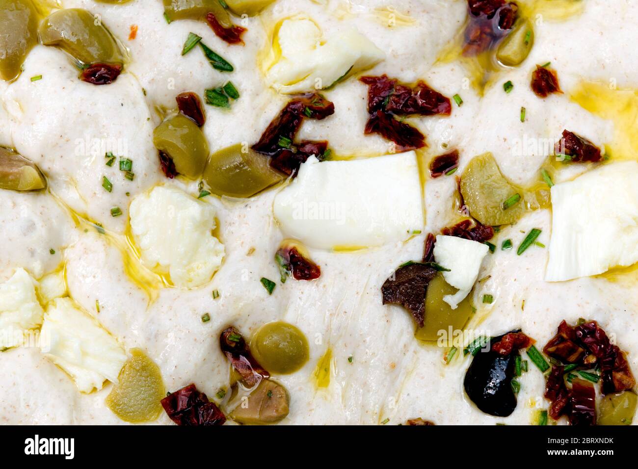 Leavened homemade Italian focaccia dough, a flat ovenbaked Italian