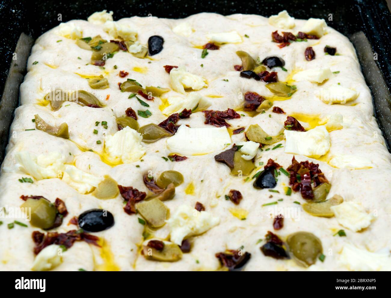 Leavened homemade Italian focaccia dough, a flat ovenbaked Italian