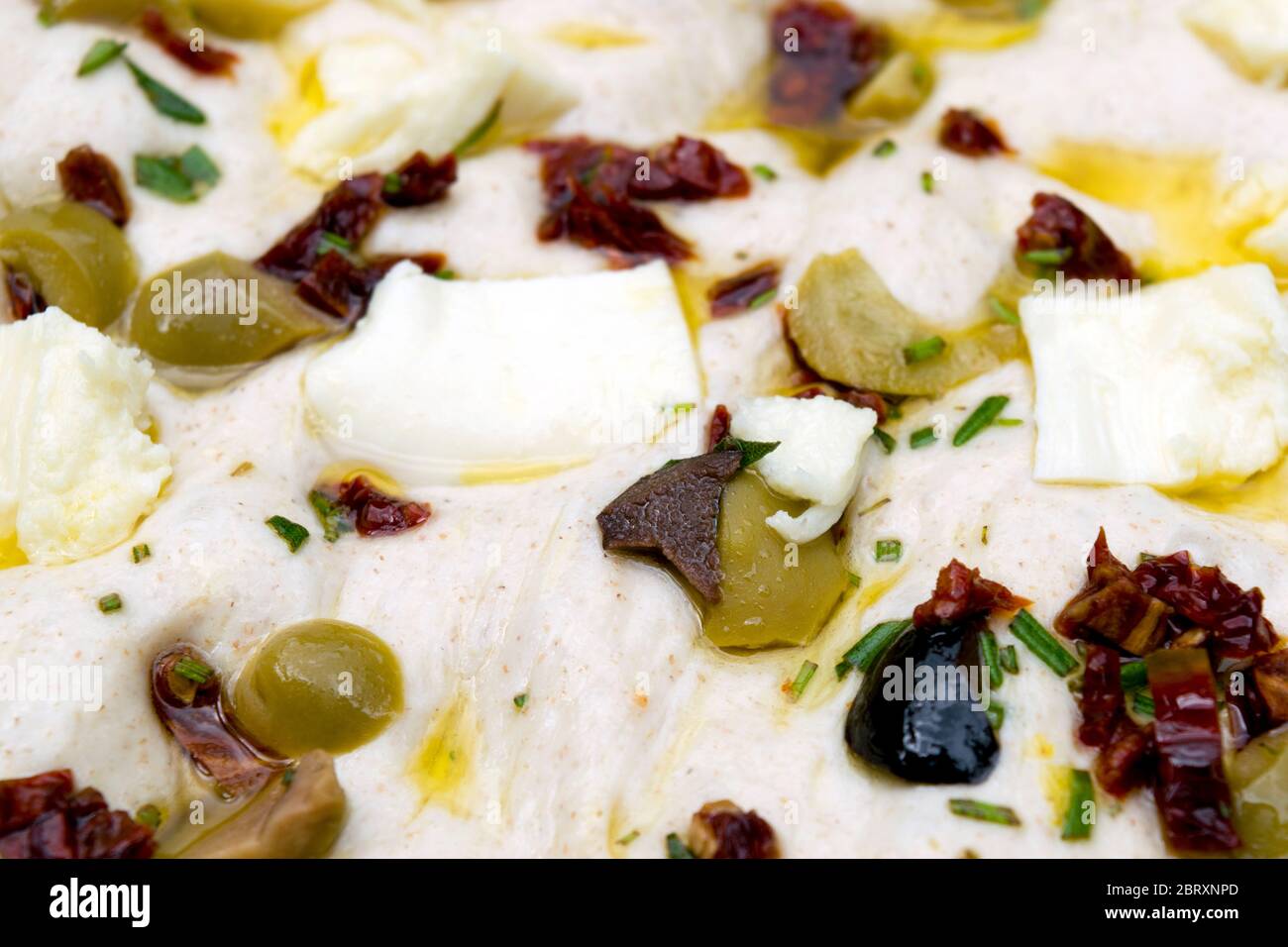 Leavened homemade Italian focaccia dough, a flat ovenbaked Italian