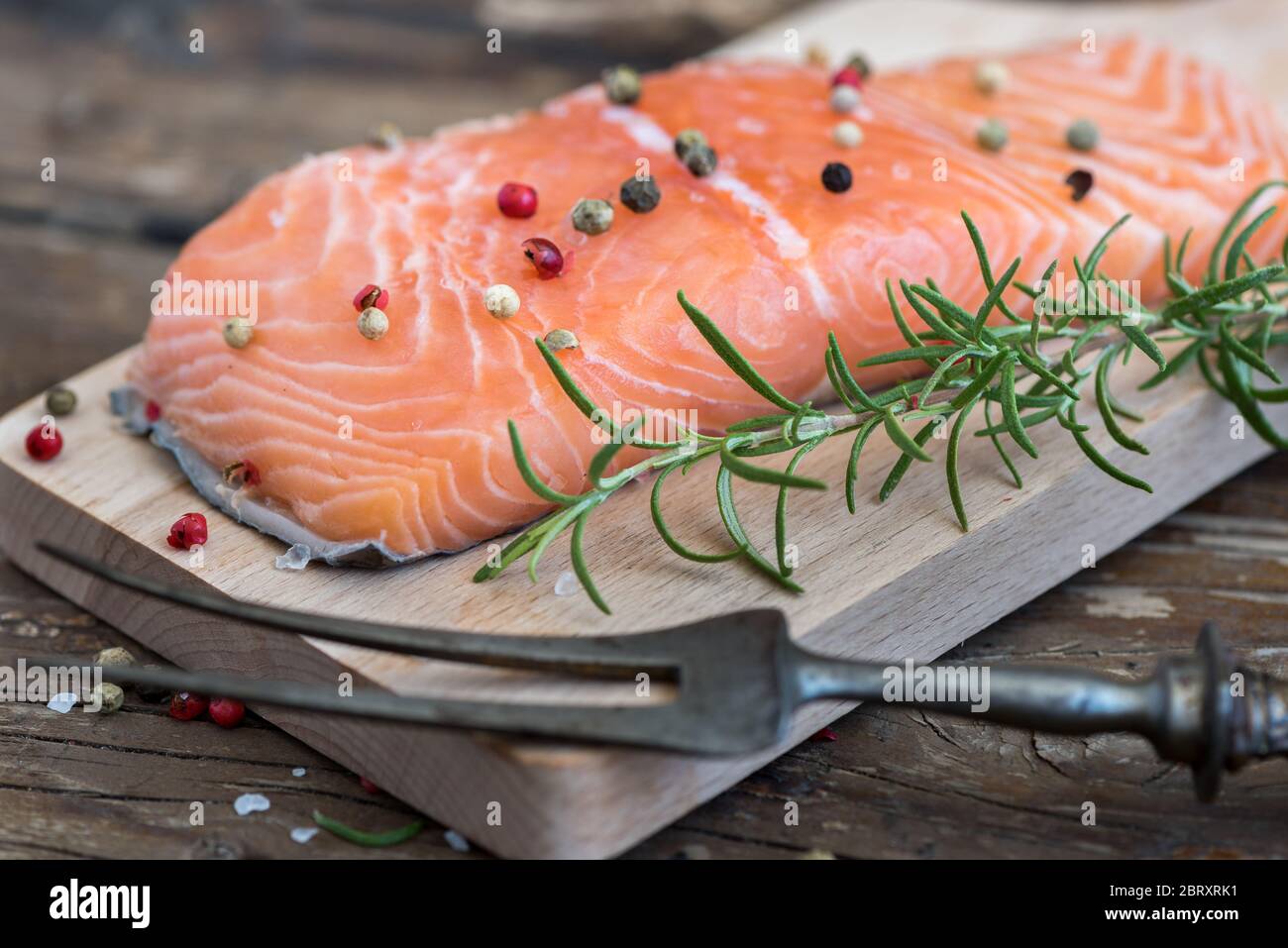 Raw Salmon Fish Fillet with Fresh Herbs on Cutting Board Stock Photo ...