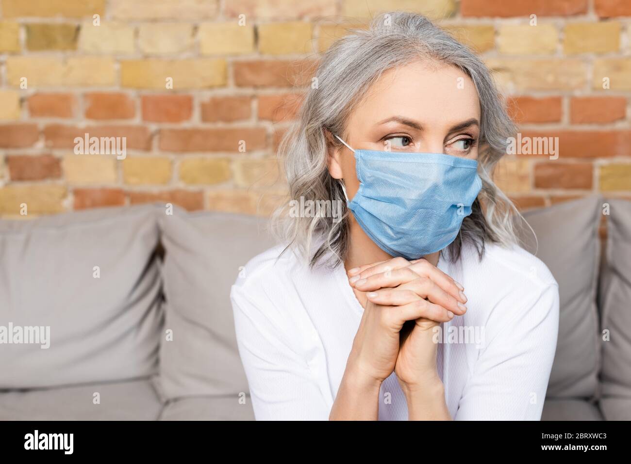 Mature woman in medical mask hi-res stock photography and images - Alamy