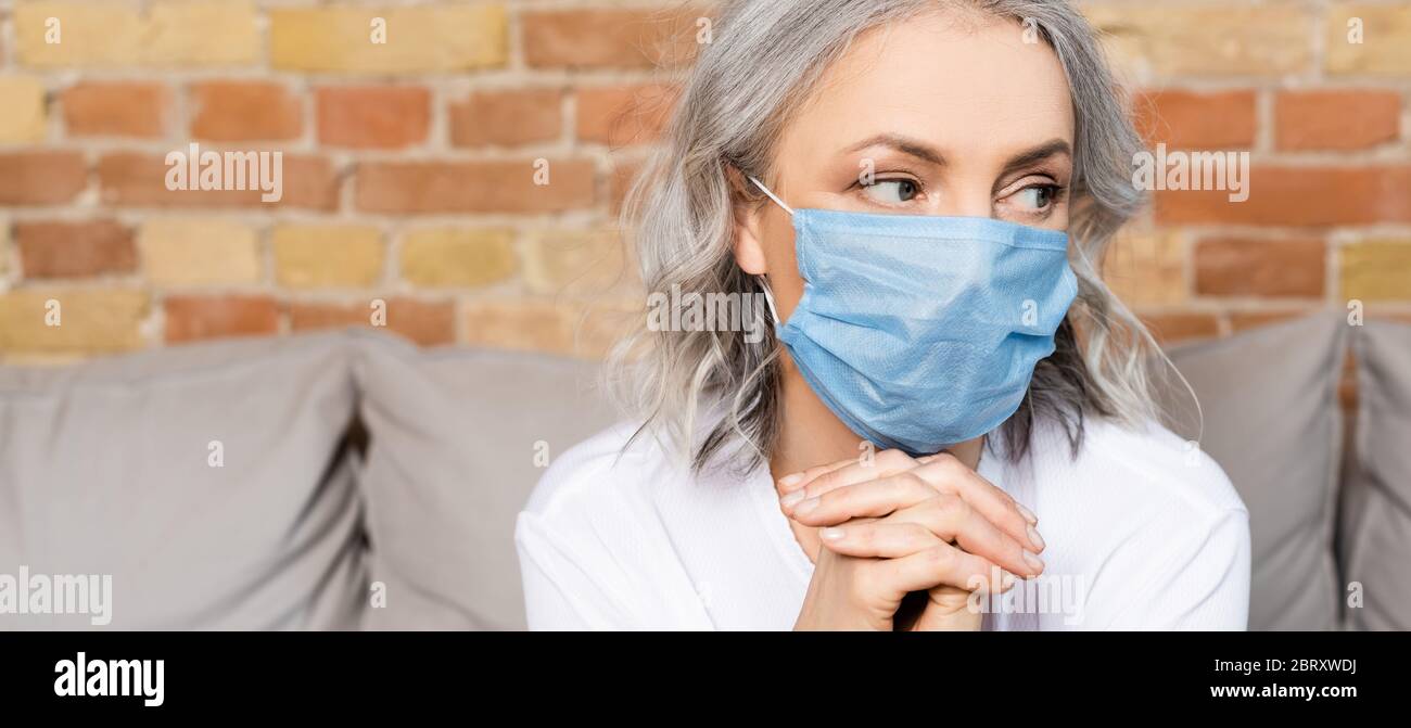 Mature woman in medical mask hi-res stock photography and images - Alamy