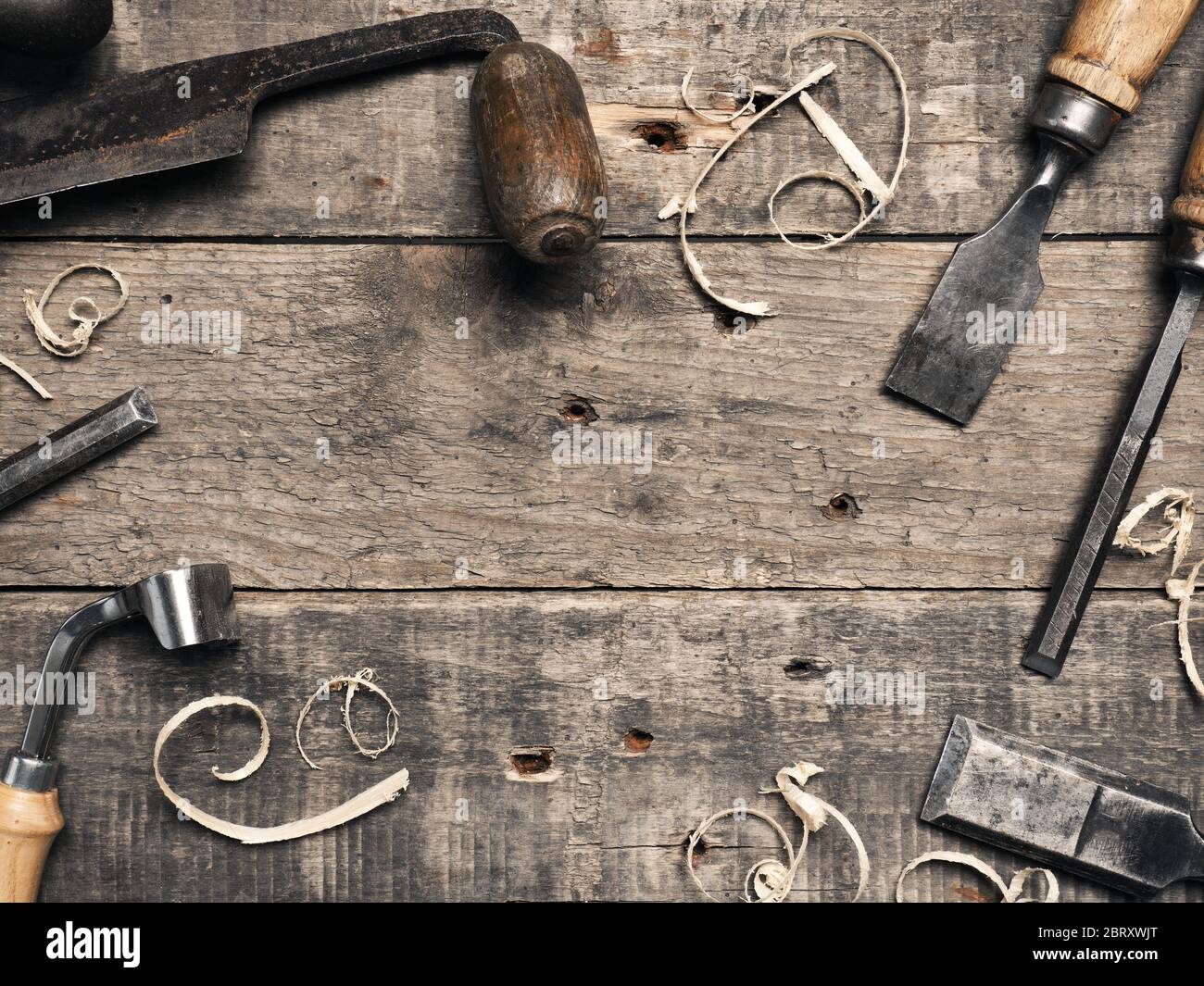 Carpenter tools on a rustic wooden background with space for text Stock Photo