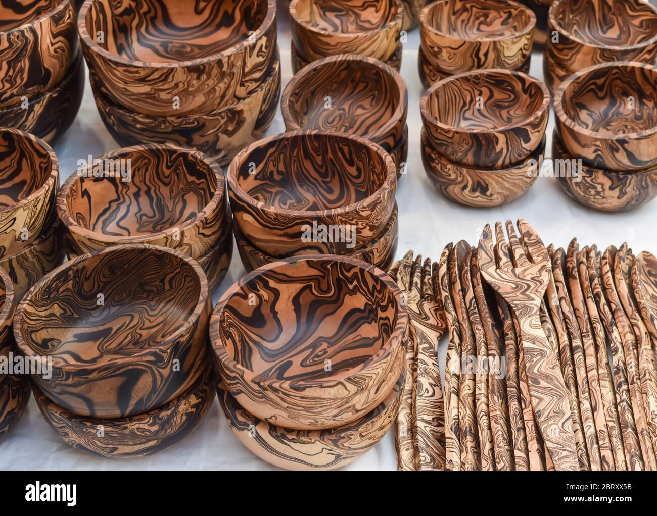 Wood products. Utensils made of wooden bowls and spoons. Exhibited for sale Stock Photo