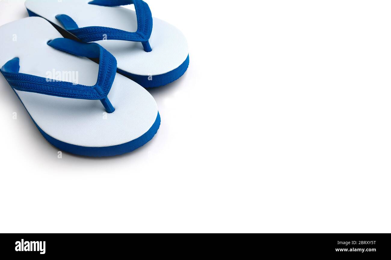 White with blue flip flops isolated on white background Stock Photo - Alamy