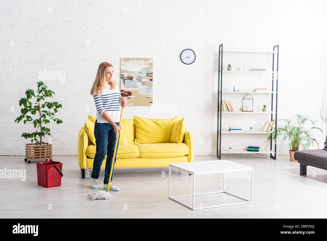 Woman cleaning up leaves hi-res stock photography and images - Alamy