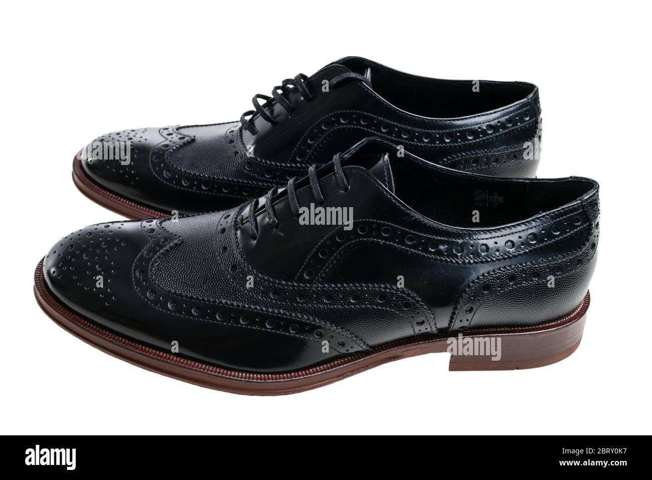 Pair of mens black brogue shoes on white background Stock Photo