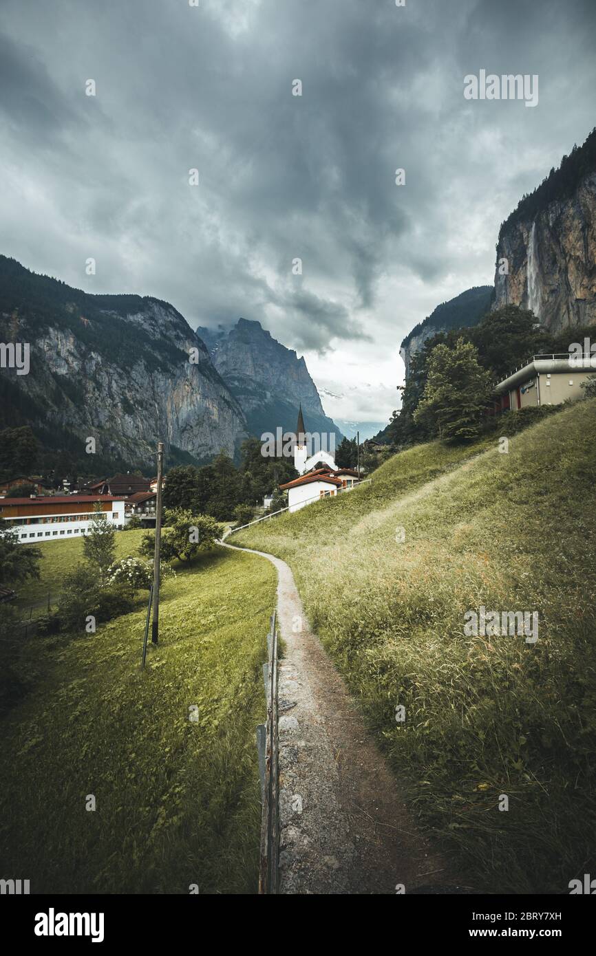 Beautiul view of Lauterbrunnen Valley against cloudy ski Stock Photo