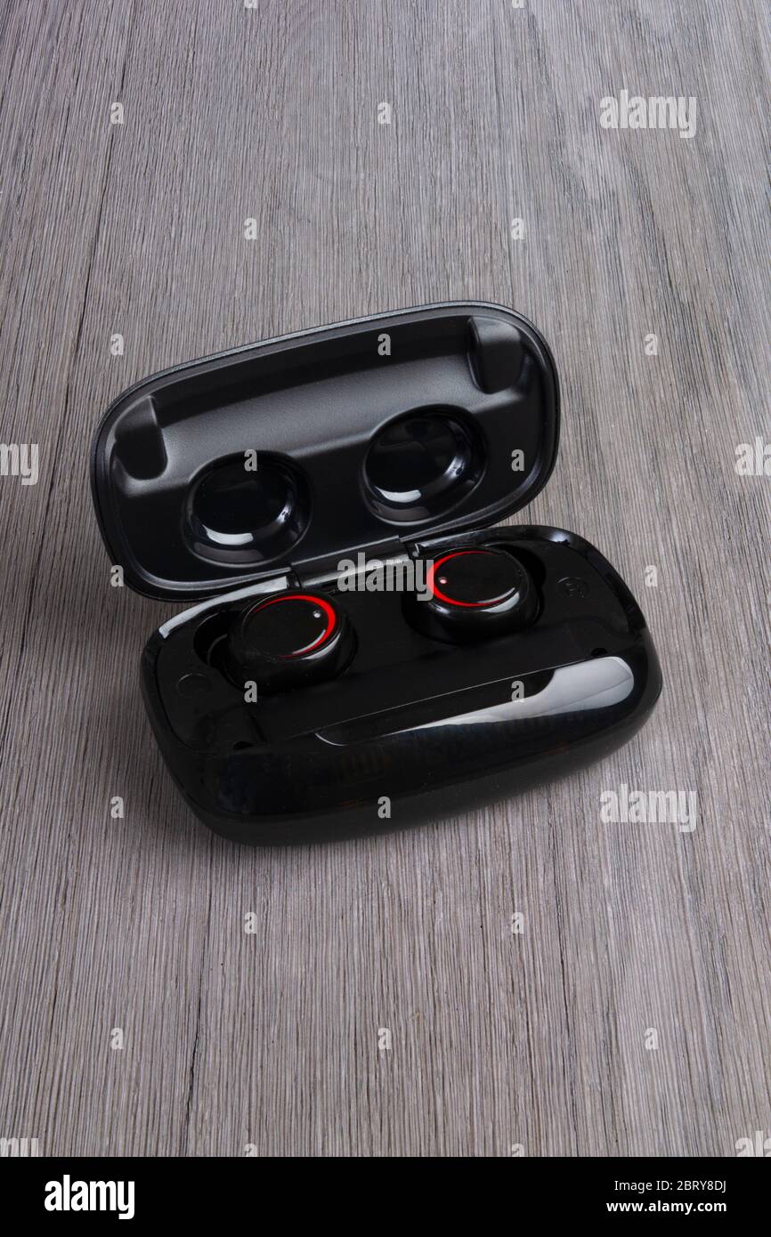 Bluetooth earbuds in a case Stock Photo