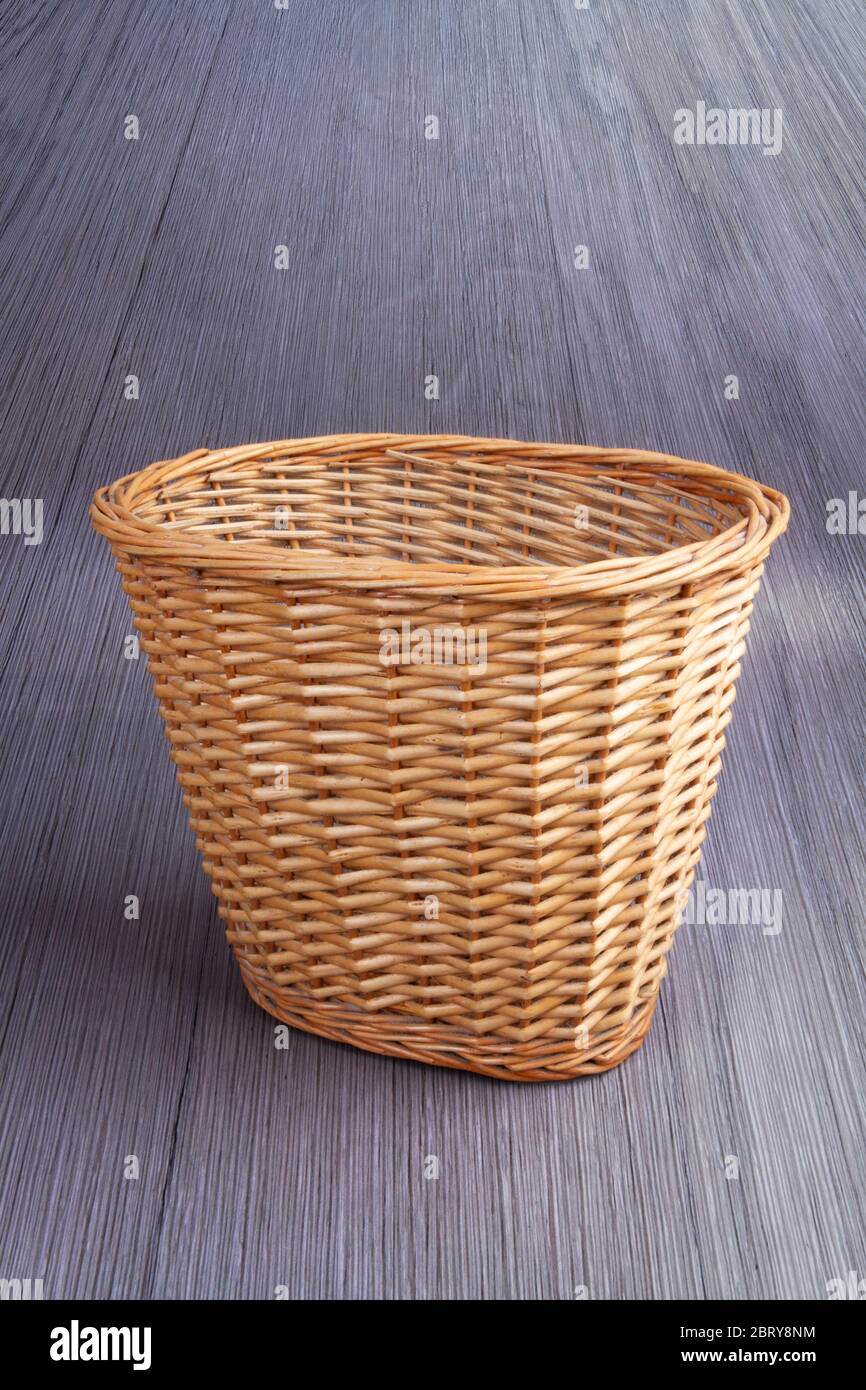 Wicker waste paper basket Stock Photo
