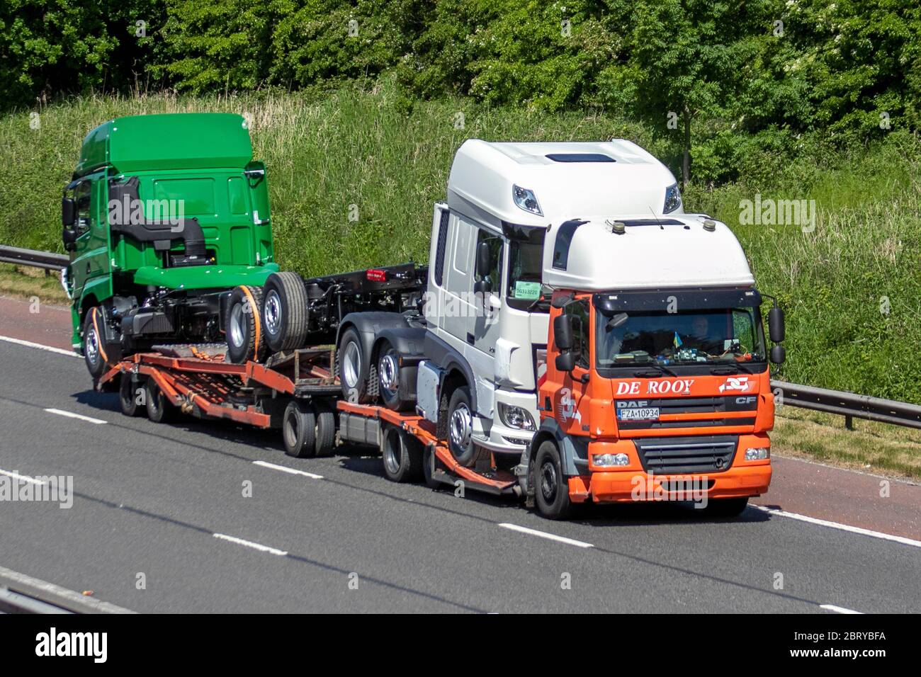 De Rooy Leyland Haulage delivery trucks, lorry, transportation, truck, cargo carrier, new DAF vehicle, European commercial transport, industry, M61 at Manchester, UK Stock Photo