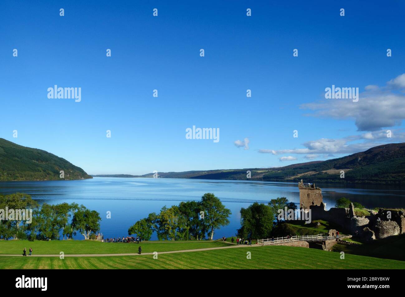 Visitors at Urquhart Castle on the shore of the world famous Loch Ness, known for the mystery sightings of 'Nessie' the Loch Ness Monster Stock Photo