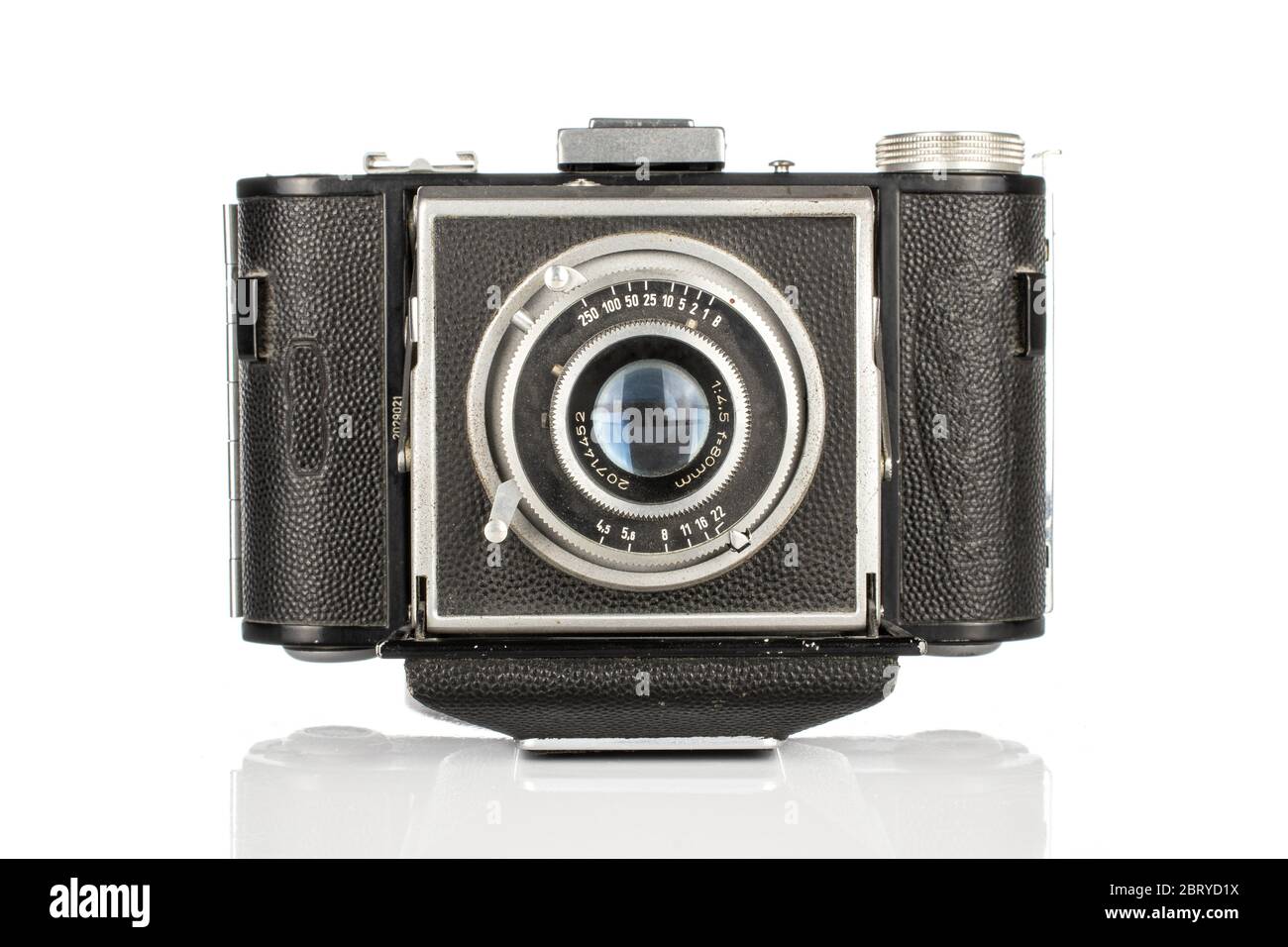 One whole closed vintage camera isolated on white background Stock ...