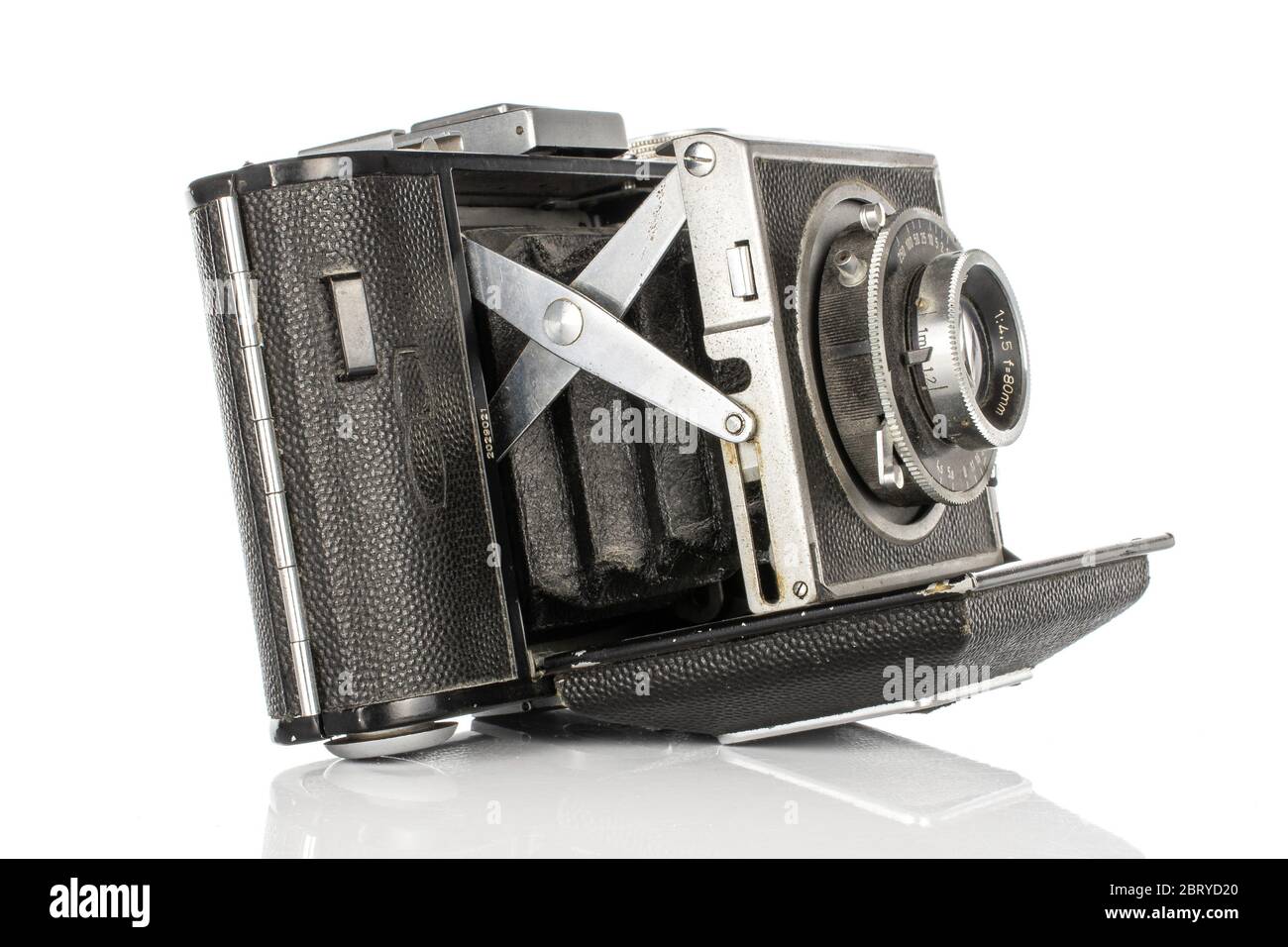 One whole open vintage camera isolated on white background Stock Photo ...