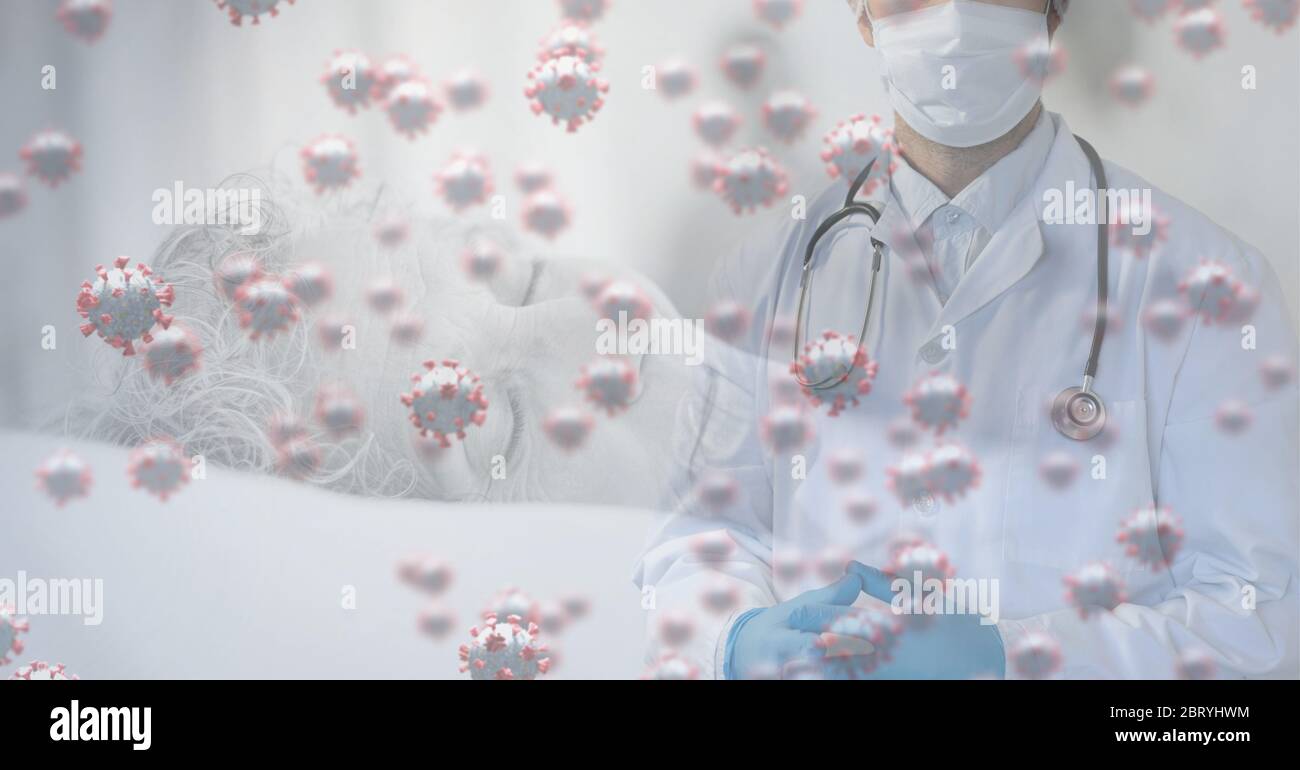 Healthcare worker wearing face mask over macro coronavirus covid19 cells spreading and senior caucas Stock Photo