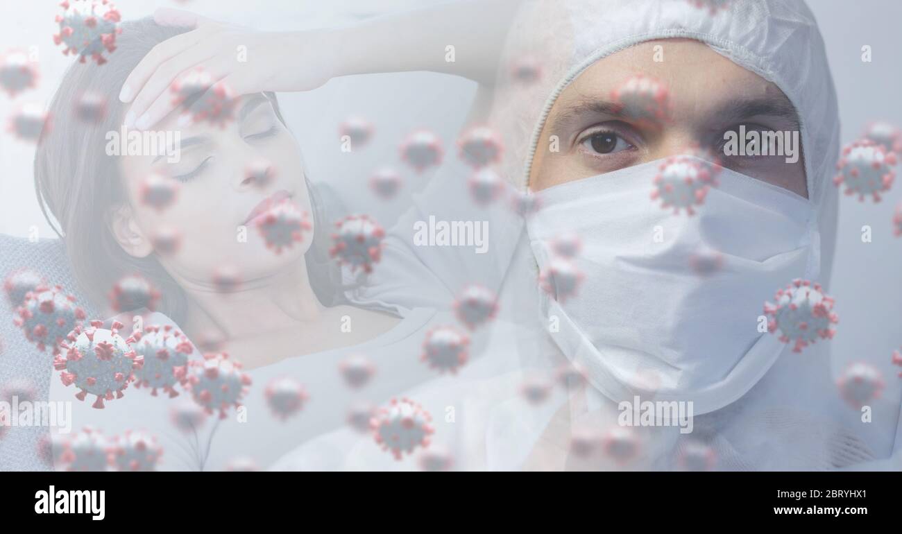 Healthcare worker wearing face mask over macro coronavirus covid19 cells spreading and caucasian wom Stock Photo