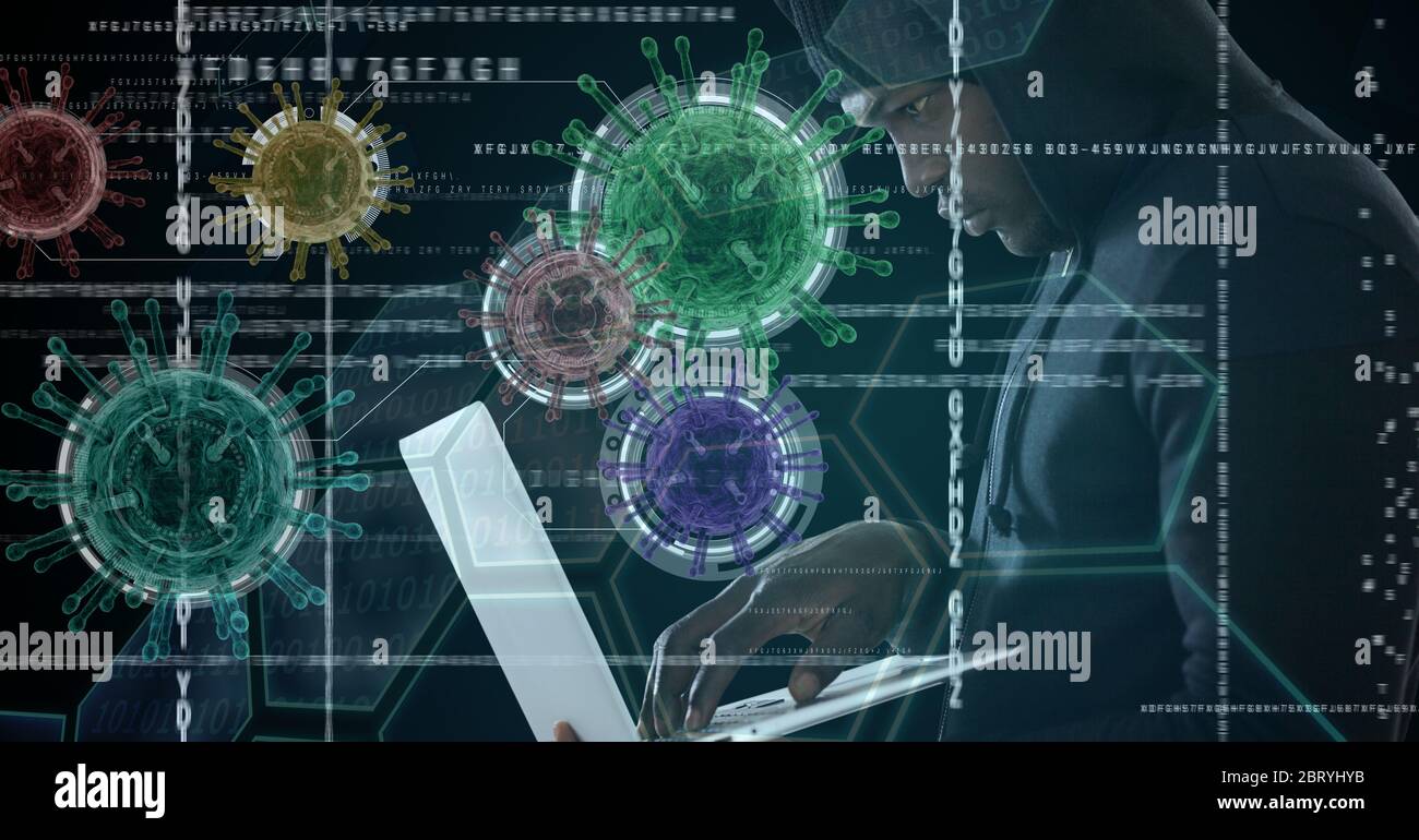 Hacker using laptop with colorful coronavirus covid cells floating over data processing Stock Photo