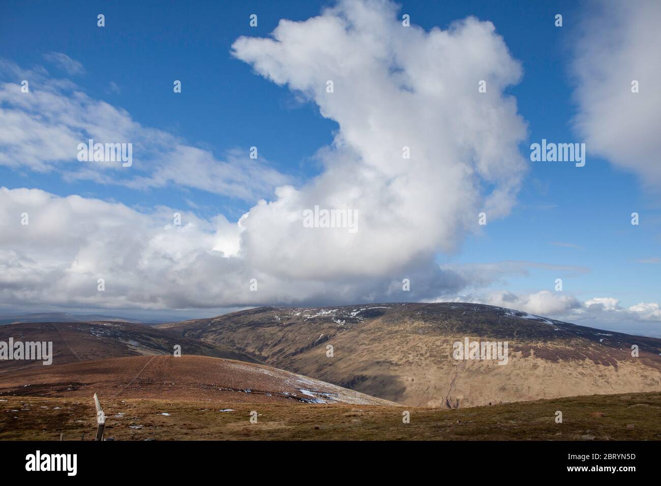 Winter view of an impressive cumulus cloud over the summit of The Cheviot in Northumberland National Park Stock Photo