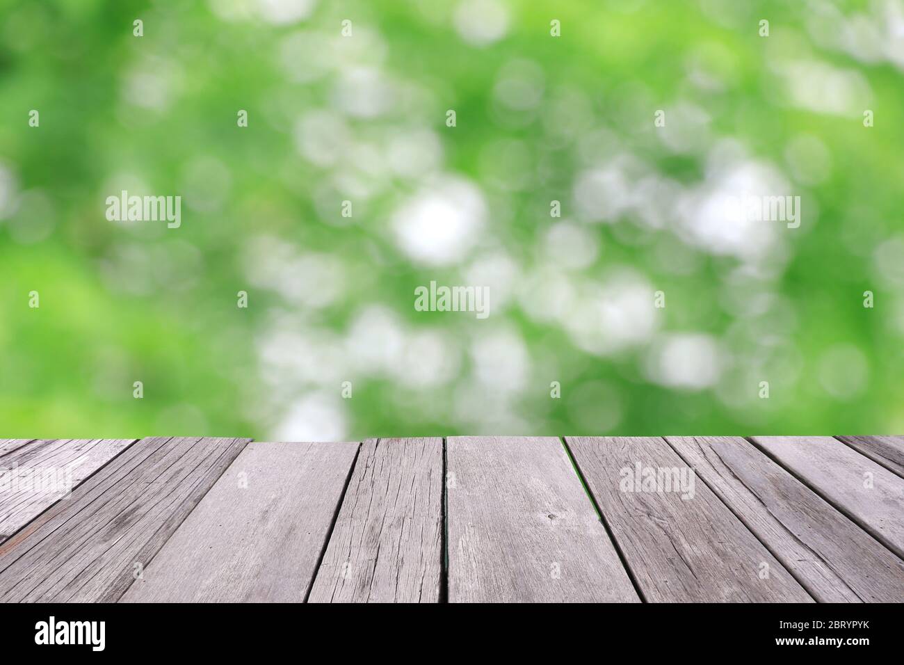 Old wooden floor with green blur background Stock Photo - Alamy
