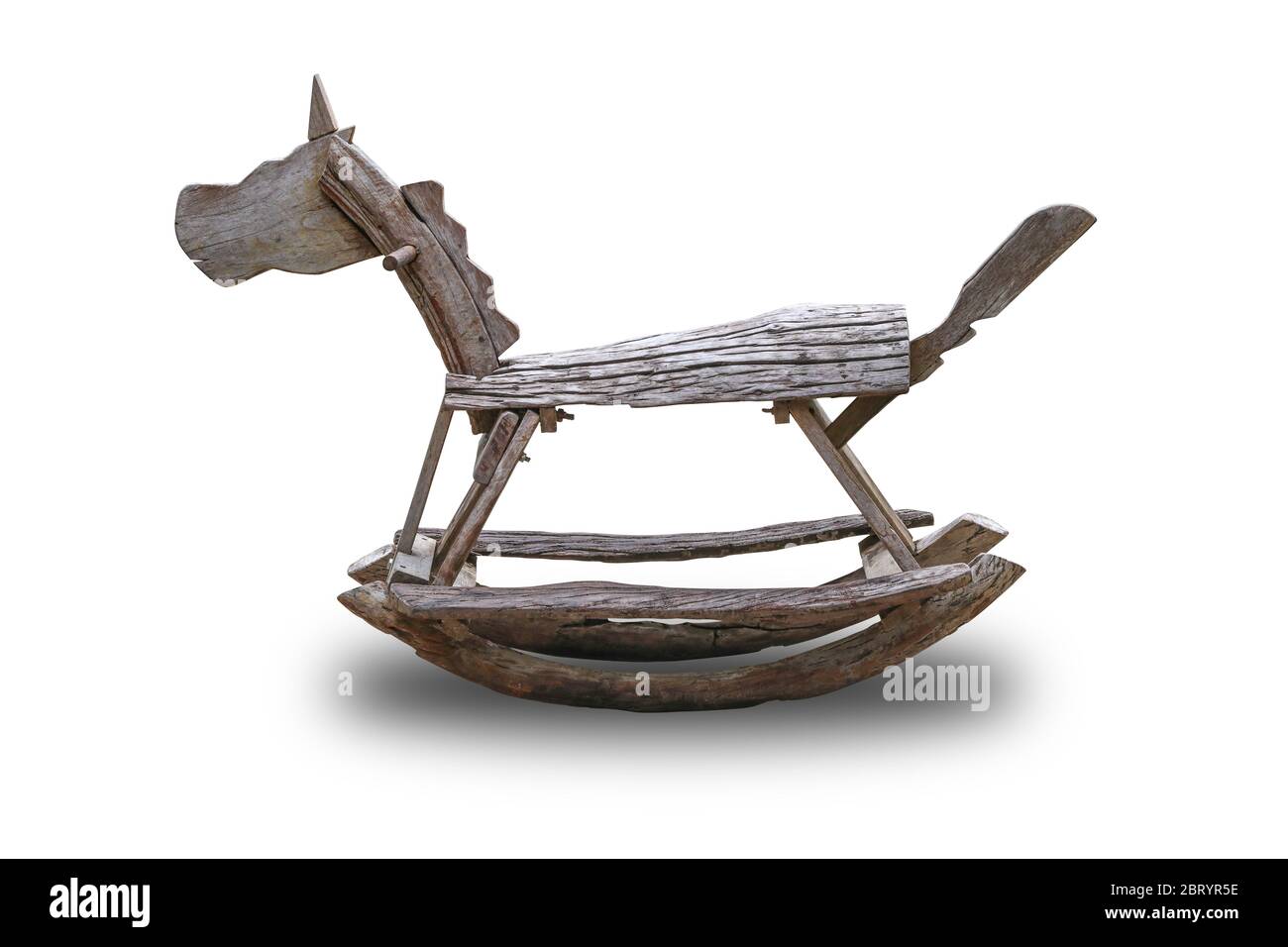 Rocking horse made of wood isolated on white background. Stock Photo