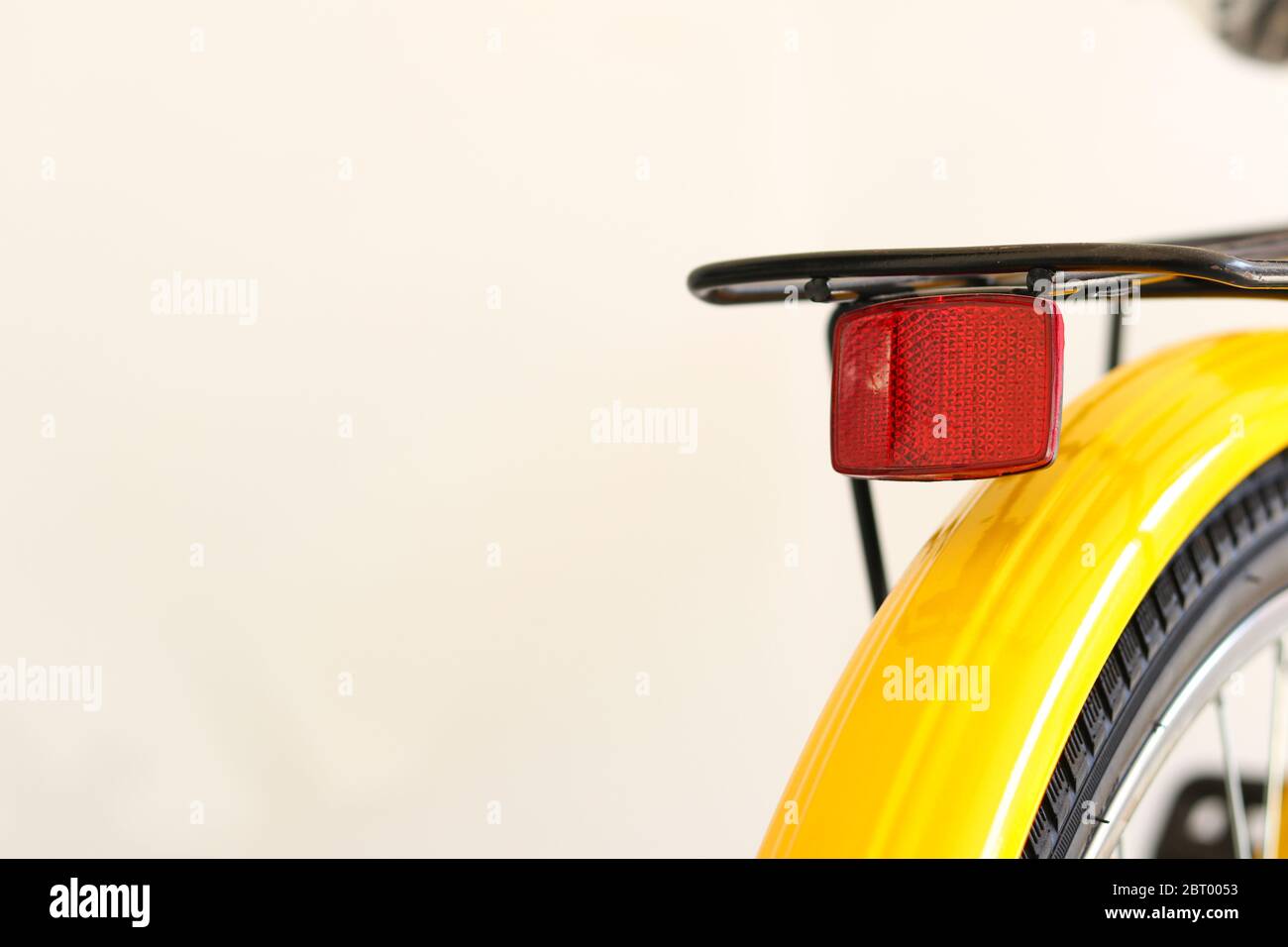 The reflector is installed on the back of the bicycle for nighttime safety. Stock Photo