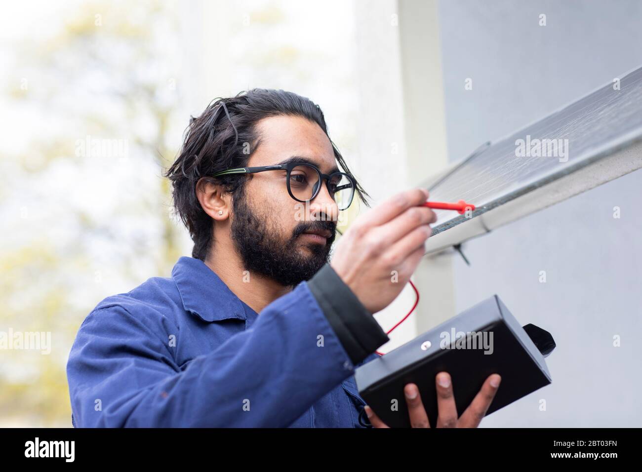 Bearded man wearing eyeglasses working on construction site. Stock Photo