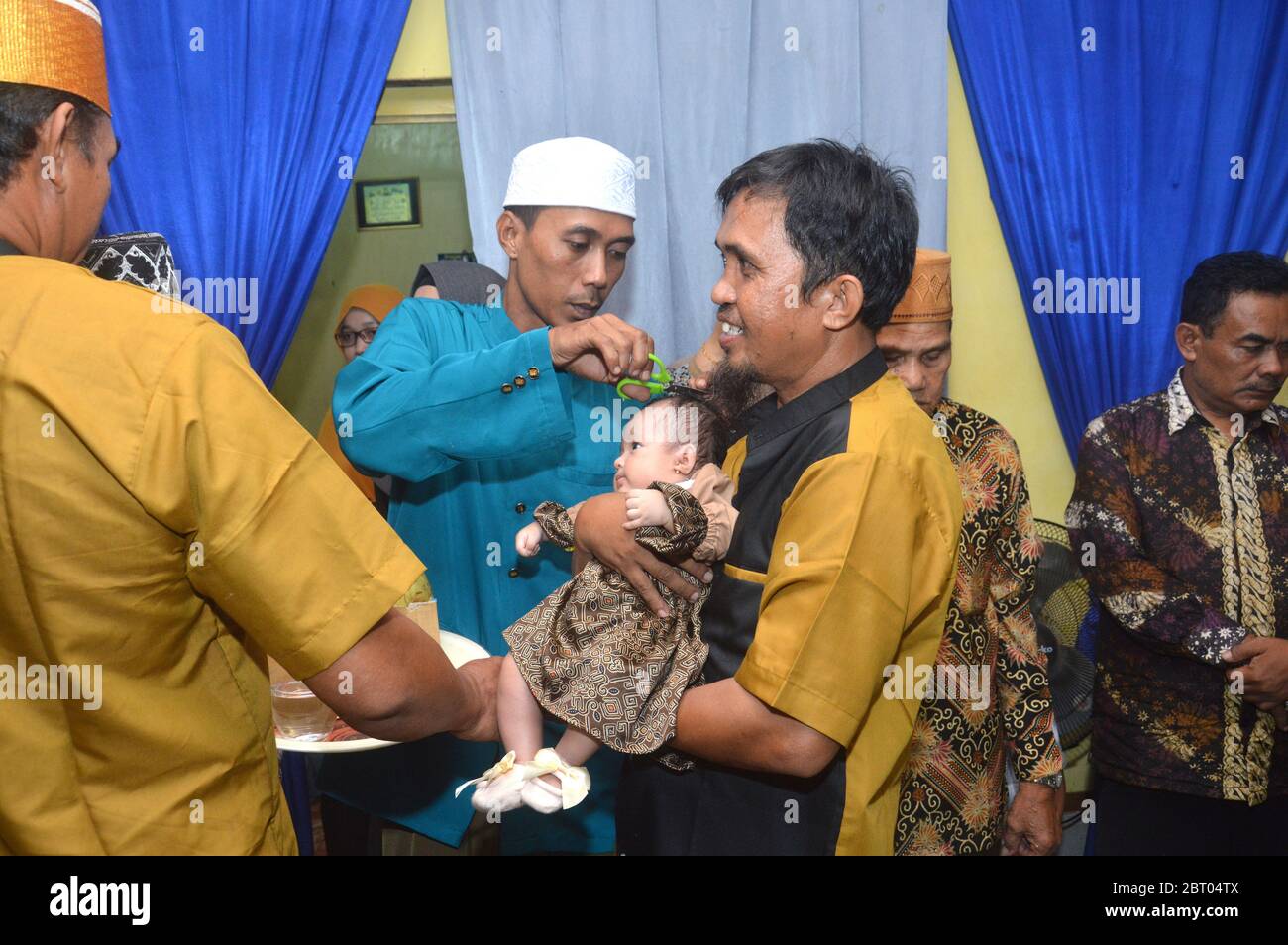 TARAKAN, INDONESIA - 19 MARCH 2020 : The first haircut for Muslim babies or  in Islam is called Aqiqah. Aqiqah ceremony is usually held after seven days  the baby is born Stock Photo - Alamy