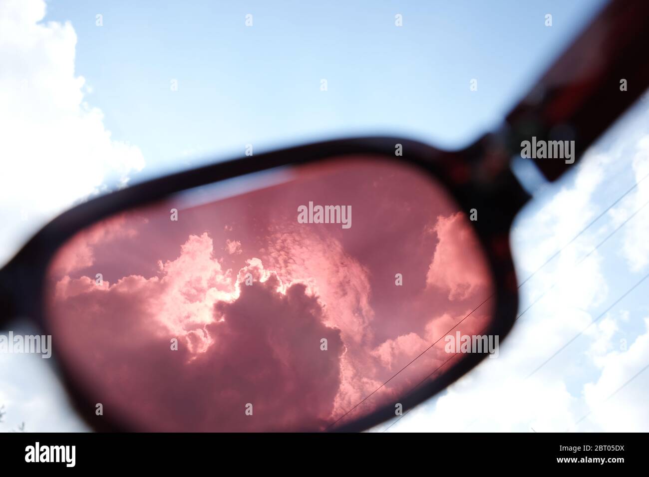 Blue sky through sunglasses Stock Photo Alamy