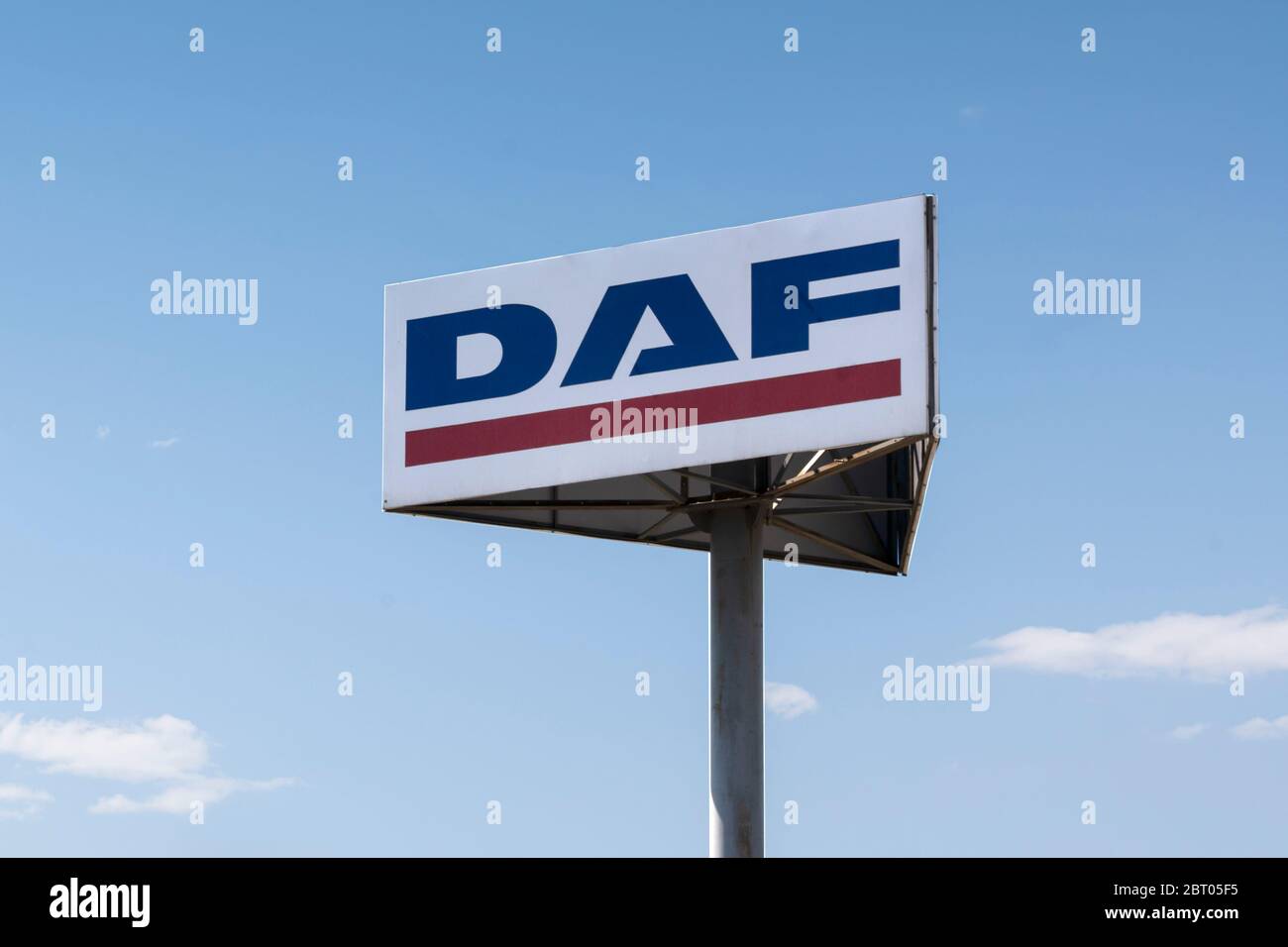 Daf-logo of a famous truck manufacturer against the sky and clouds Stock Photo