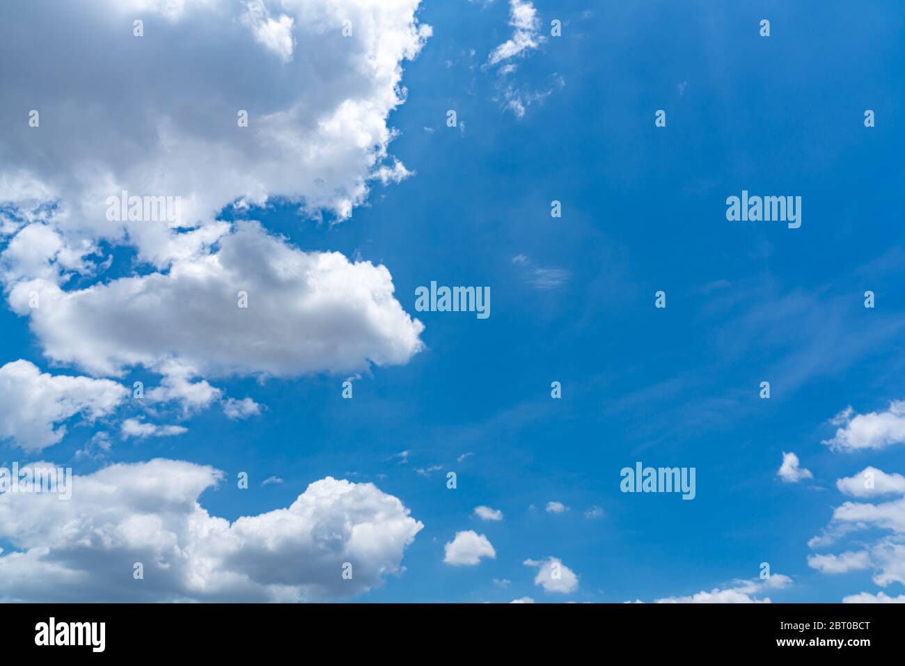 Beautiful blue sky background with white clouds in rainy season of Thailand. Stock Photo